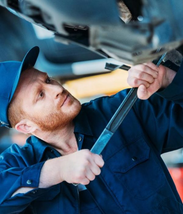 stock-photo-automechanic-working-on-car